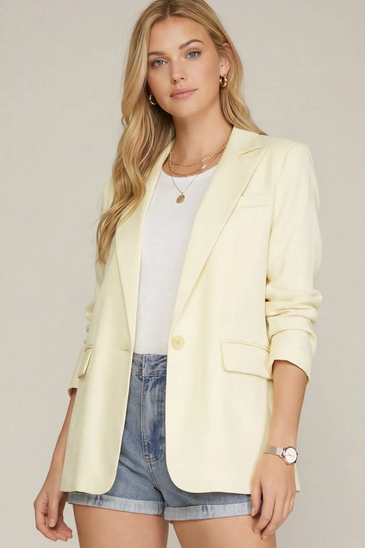 Cream single breasted blazer with front pockets